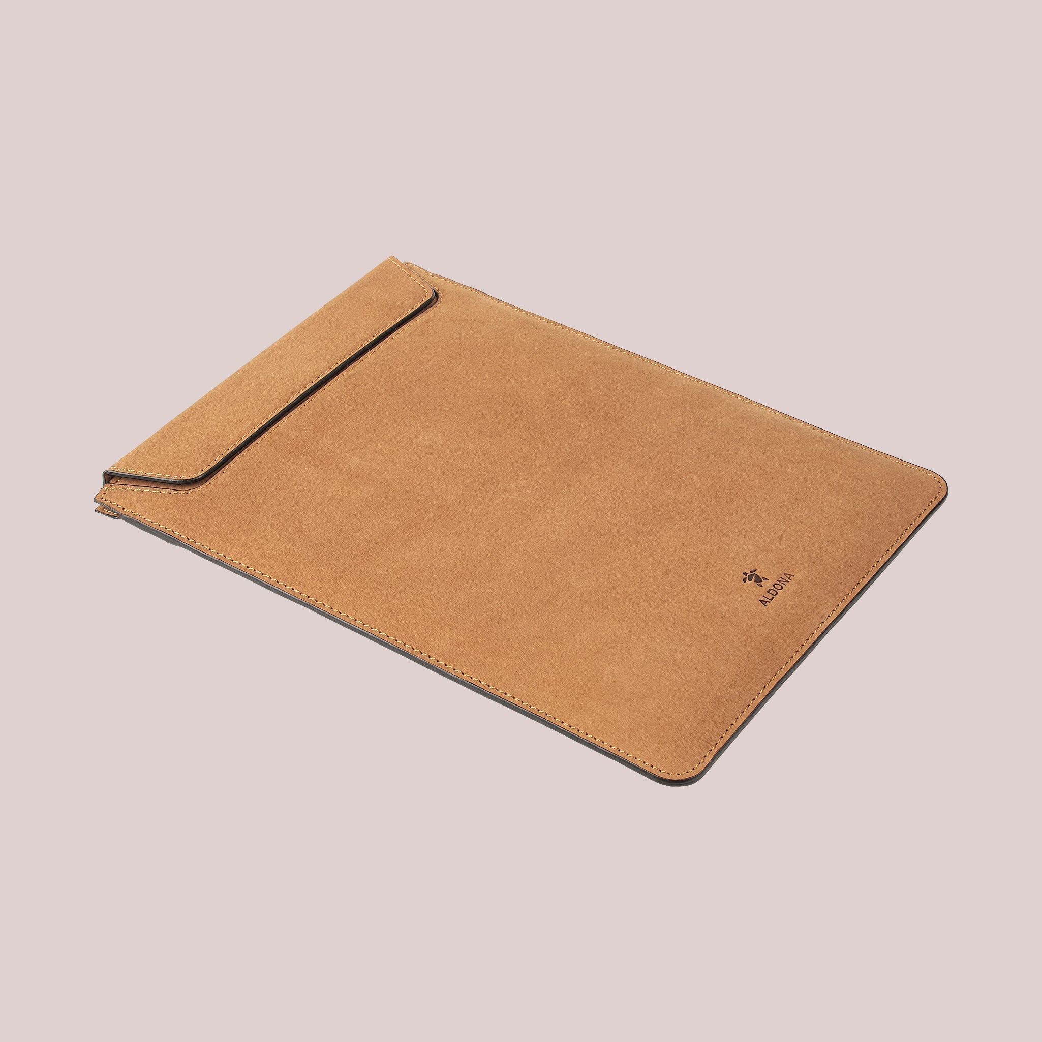 Protect your Macbook with a tan leather sleeve